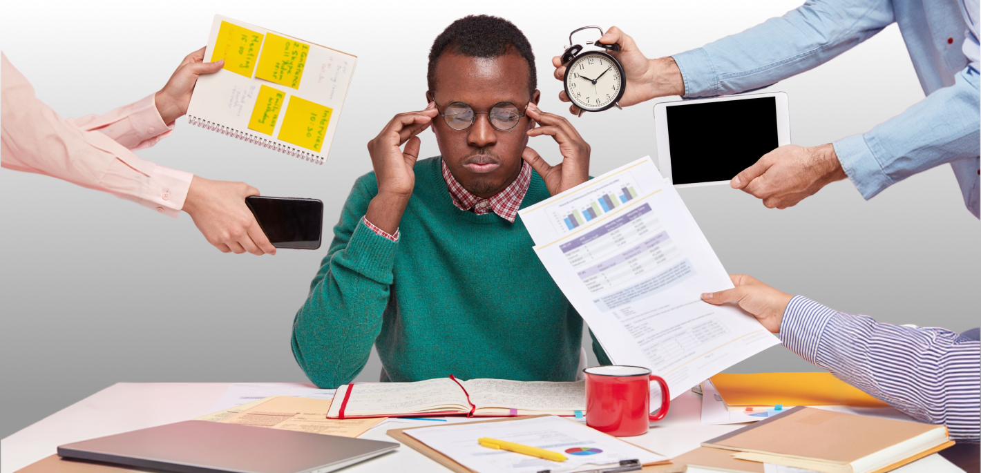 An overwhelmed online student holding his head while multiple hands offer a clock, tablet, phone, and documents.